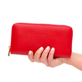 Portafoglio da donna in pelle liscia rossa, chiusura laterale con zip, interno in cuoio naturale, prodotto da Pianigiani.